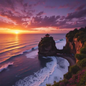 The iconic Uluwatu Temple perched on a dramatic cliff, silhouetted against a fiery orange and purple sunset over the Indian Ocean.